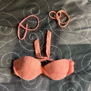 Size small coral swimsuit comes with straps